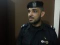 شرطي من غزه يضع على صدره صورتين لابو عمار و هنيه بينهما القدس - شاهد
