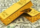 الذهب يتراجع مع صعود الدولار والنفط يهبط بأكثر من دولار