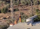 مستوطنون يجرفون أراضي في قرية أم صفا شمال غرب رام الله